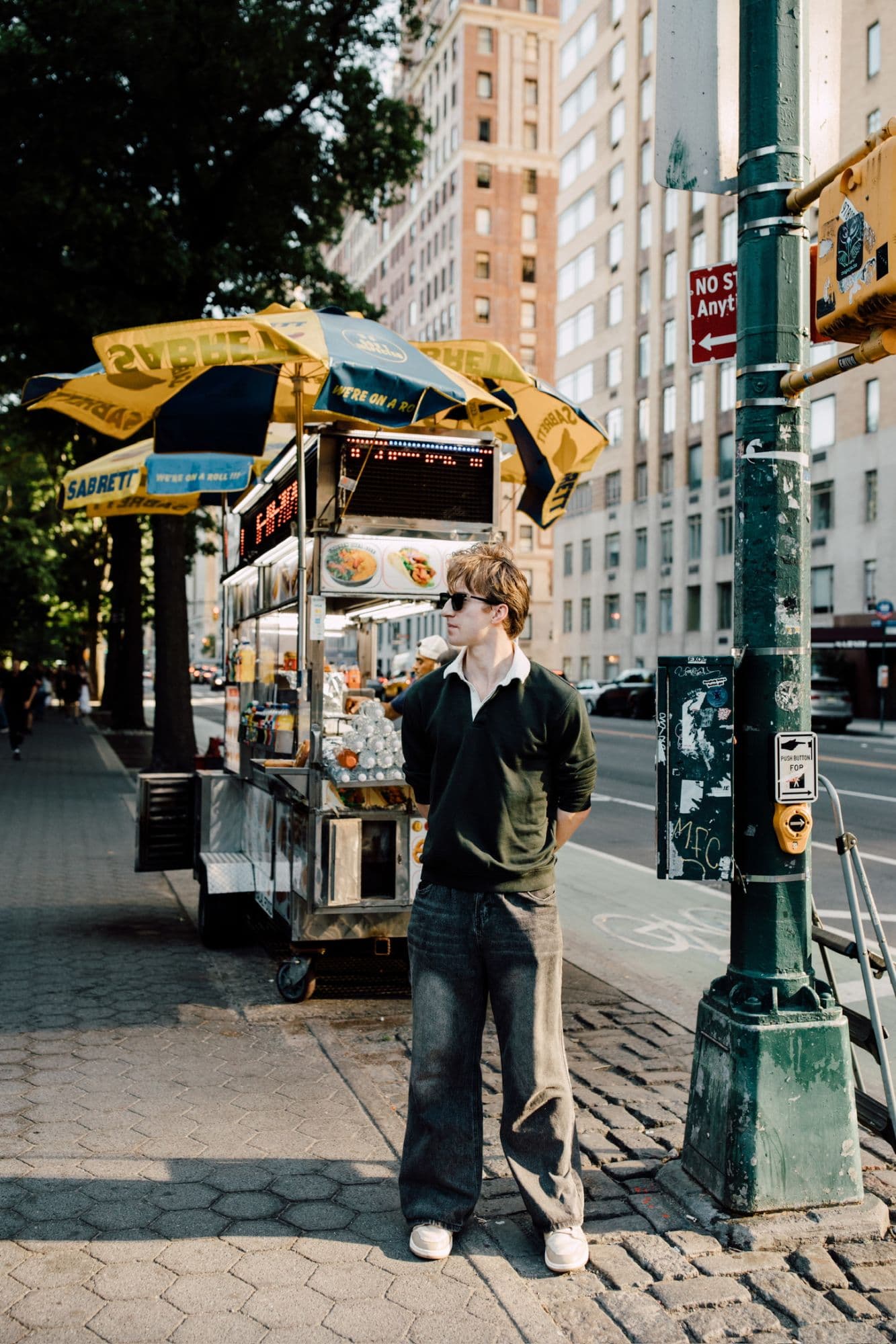 Street-side hot dog cart under Sabrett umbrellas near Central Park, New York
